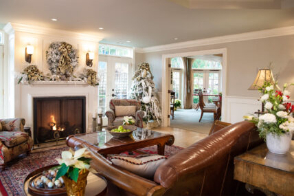 A festive room with a fireplace at Harbour House Hotel in Niagara-on-the-Lake.