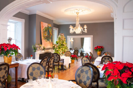 A dining room set up for the Holiday Sparkle package.