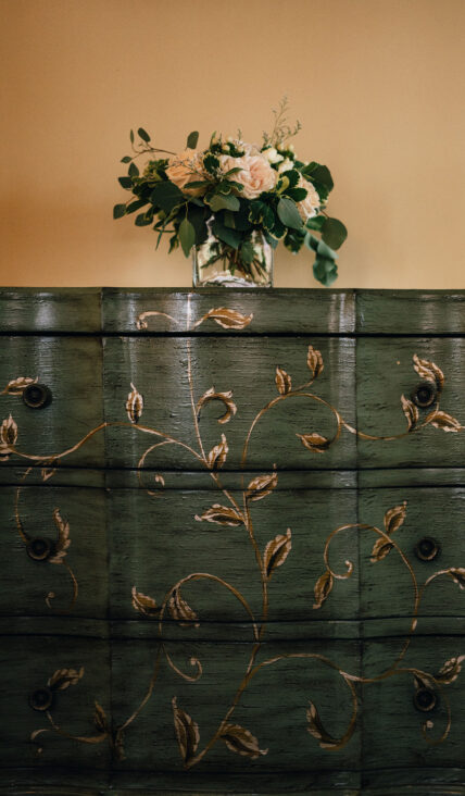 Flowers on top of a dresser in the Newark Room in The Charles Hotel in Niagara-on-the-Lake.