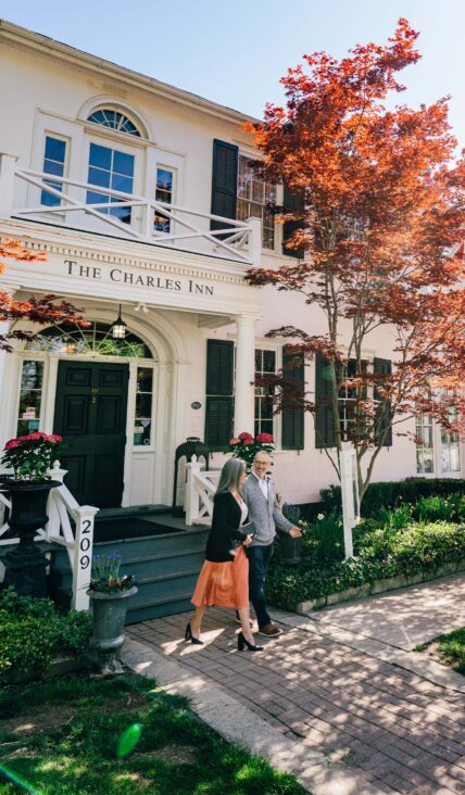 A couple walking out of The Charles Hotel in Niagara-on-the-Lake.