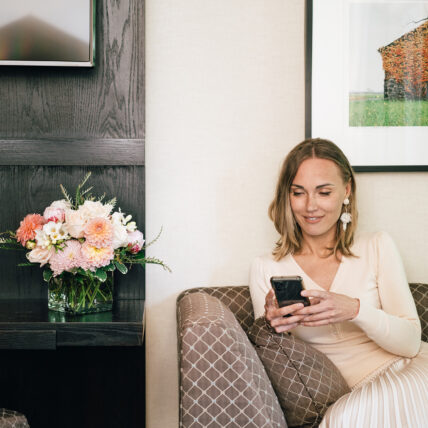 A woman on her phone at the Shaw Club in Niagara-on-the-Lake.