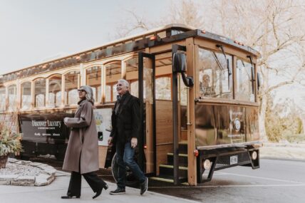 Couple departing the Vintage Hotel San Fransico-style trolly in Niagara-on-the-Lake